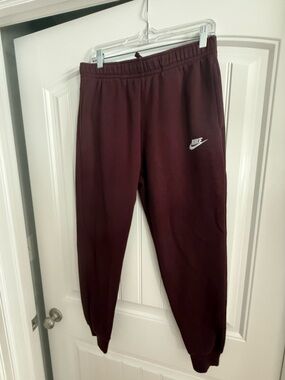 Nike Burgundy Sweatpants with White Swoosh Tag